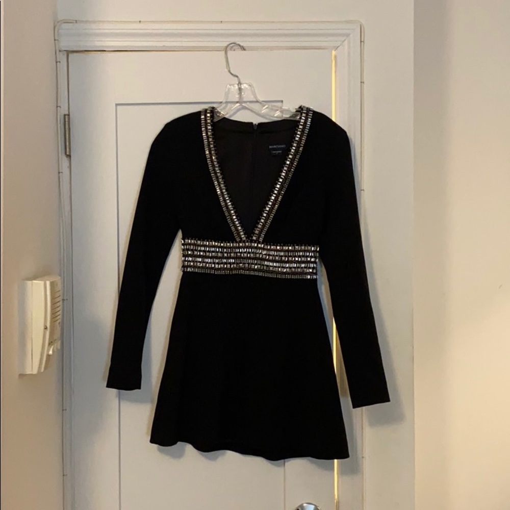 Black evening dress with crystal detailing.